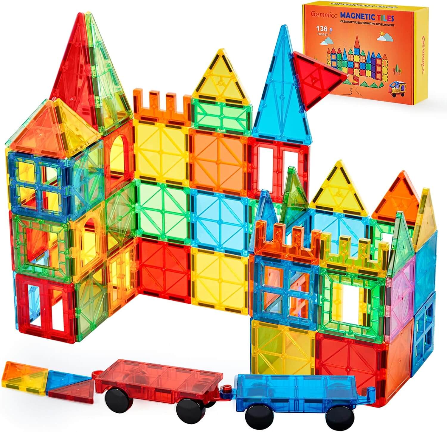 Colorful Gemmicc Magnetic Tiles assembled into various 3D structures on a play mat.